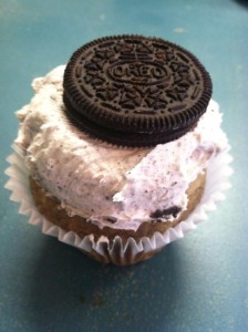 Oreo cake with Oreo buttercream frosting topped with an Oreo cookie